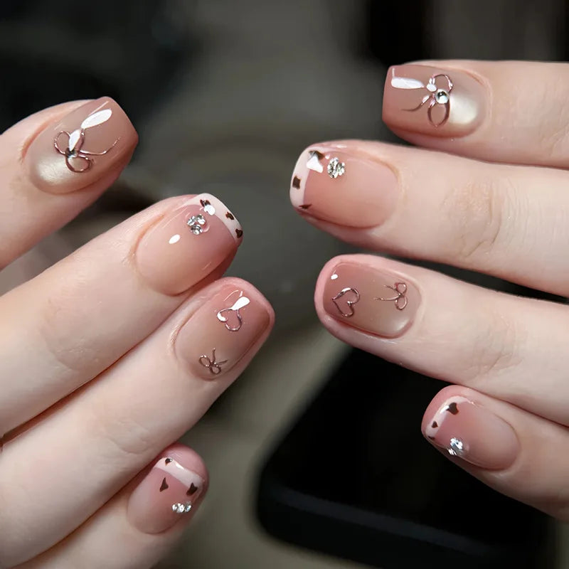 Decorated nail designs shown on hands