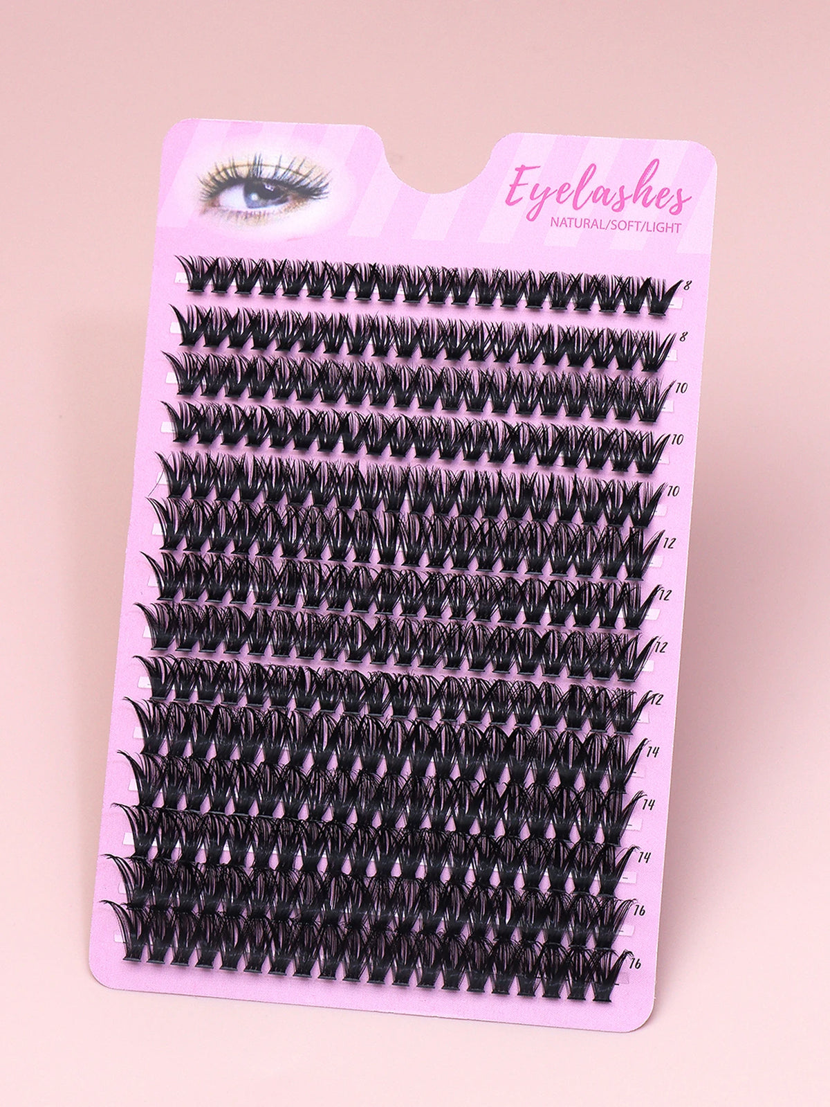 False eyelash clusters arranged in rows in a tray