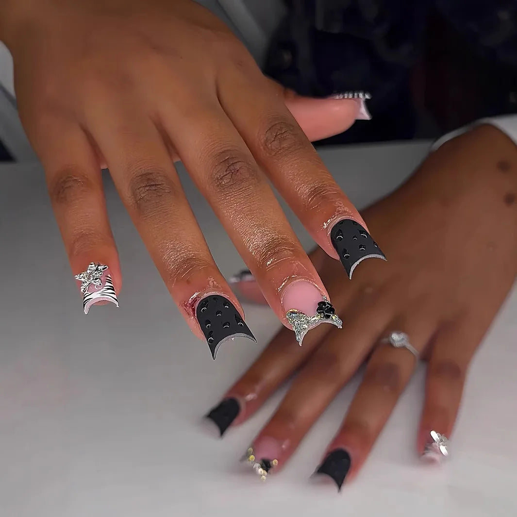Decorative nail designs with raised accents shown on hands