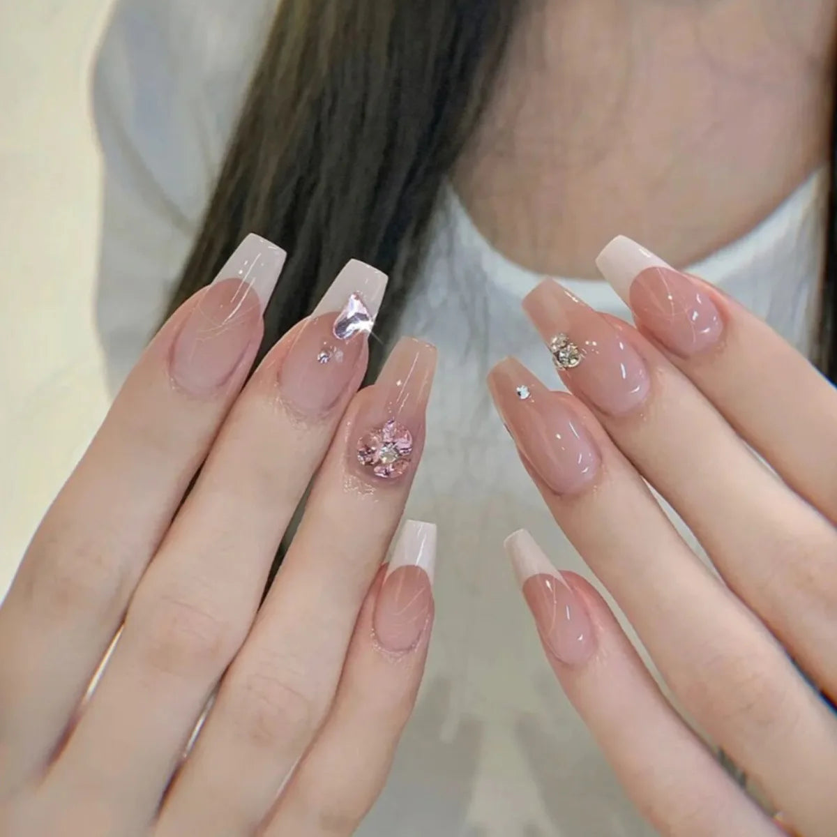 Decorated nail designs shown on hands