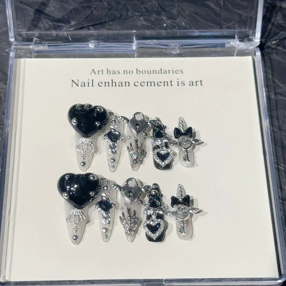 Decorated press-on nail sets with raised embellishments on display cards