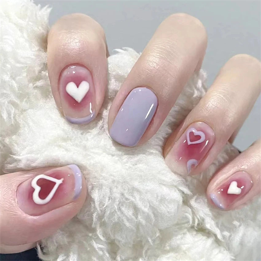 Decorated nail designs shown on hands