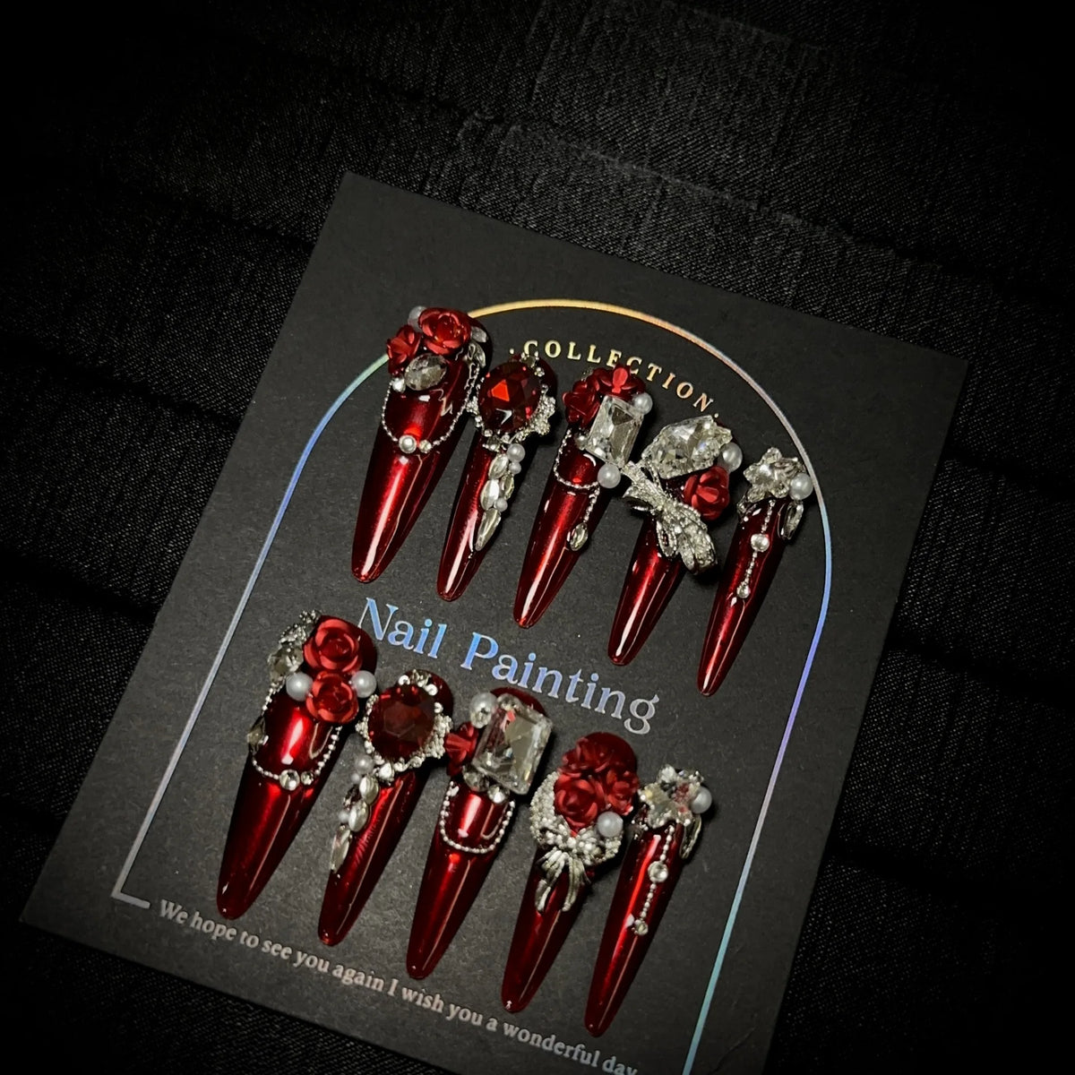Gem-encrusted press-on nail set with size label
