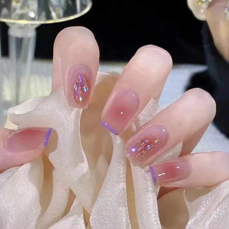 Decorated nail designs shown on hands