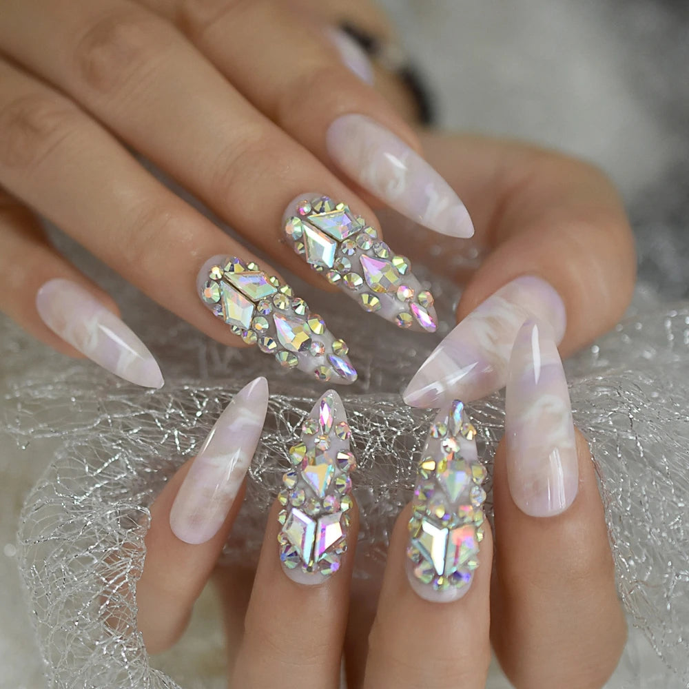 Rhinestone-decorated nail designs shown on hands