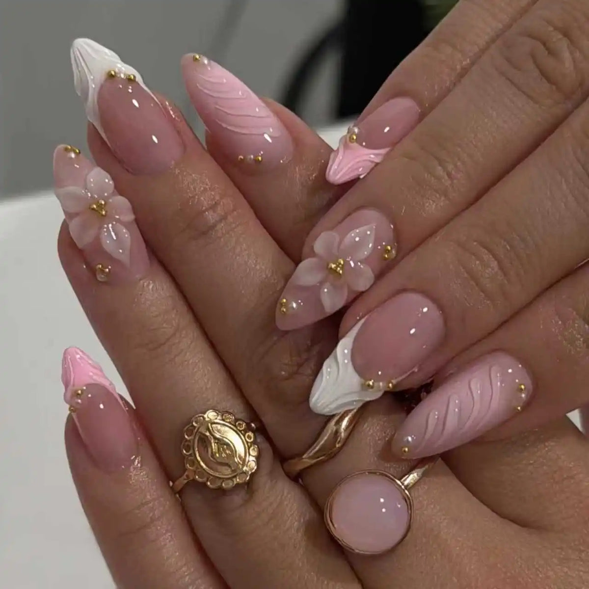 Decorated nail designs shown on hands