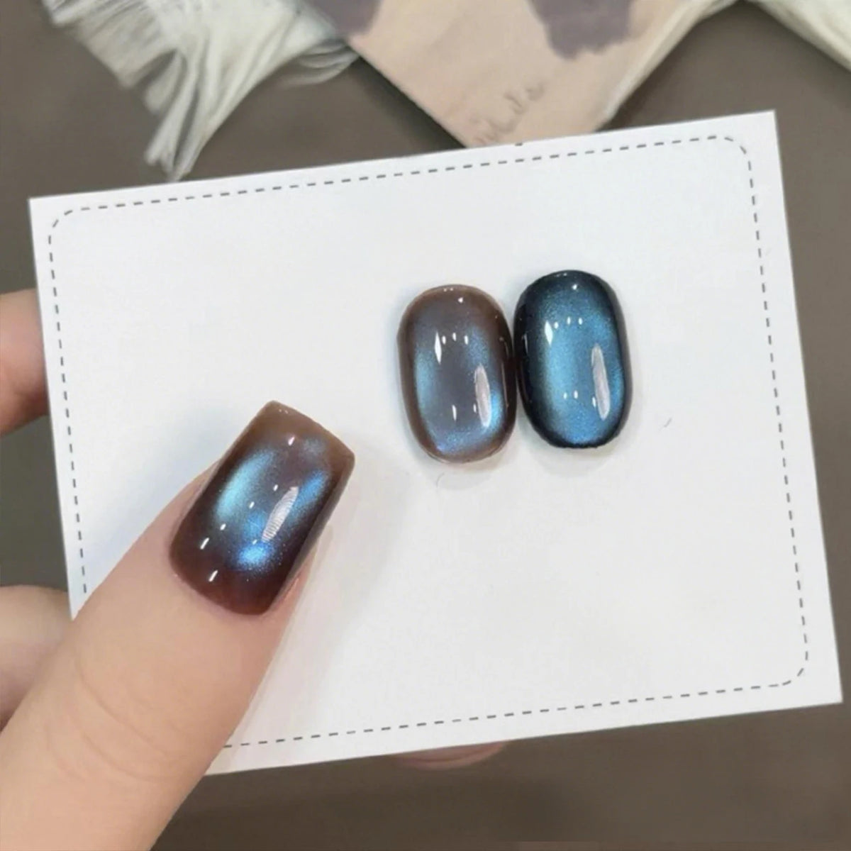 Chrome press-on nails displayed on a white card