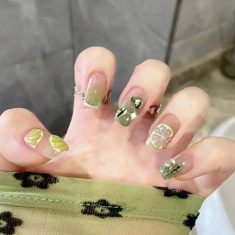 Decorated nail designs shown on hands