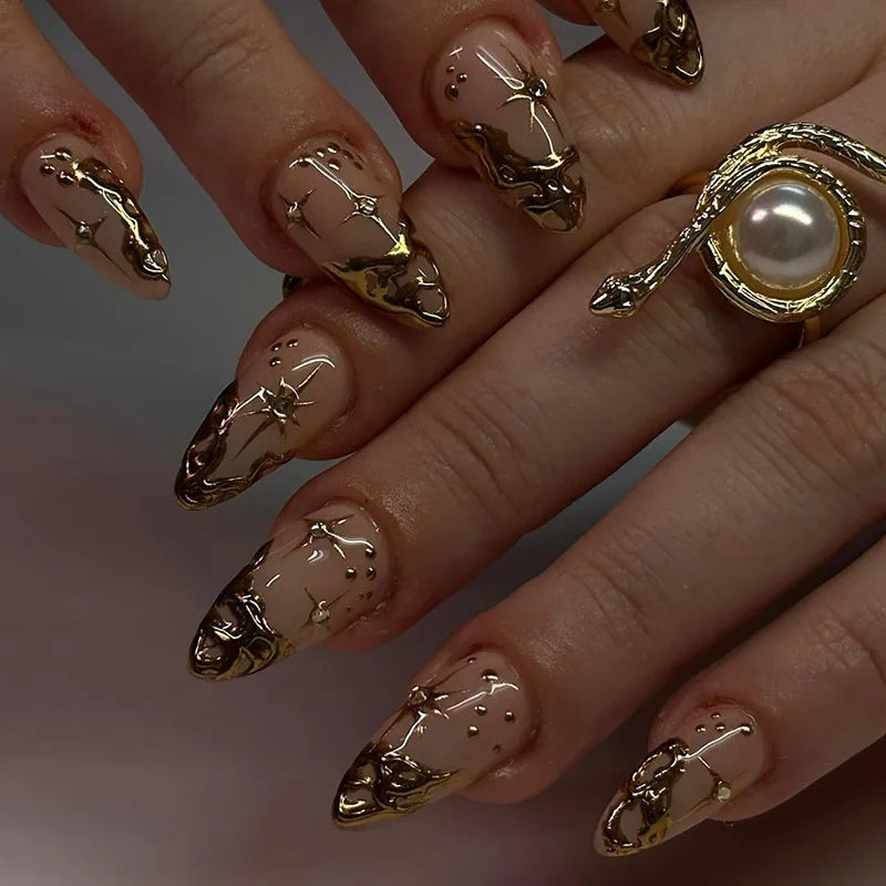 Metallic and embellished nails shown on hands