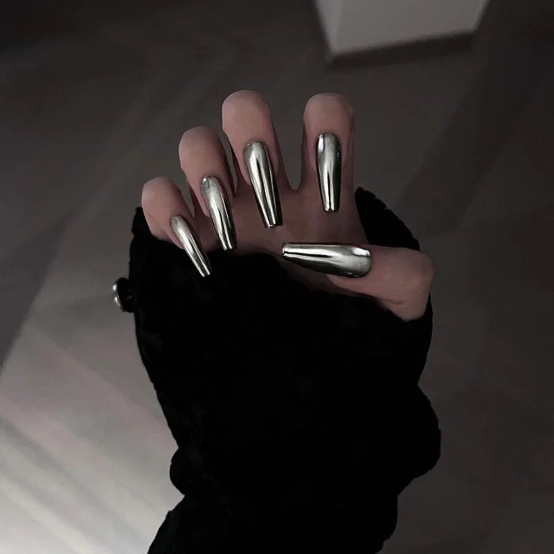 Silver metallic nails shown on hands