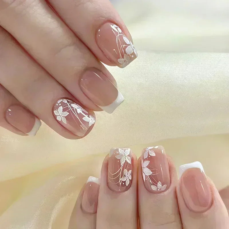 Decorated nail designs shown on hands