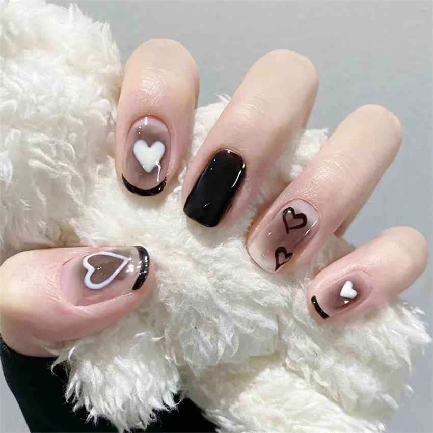 Decorated nail designs shown on hands