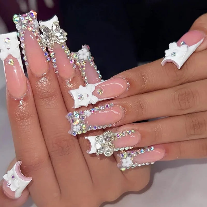 Decorated nail designs shown on hands