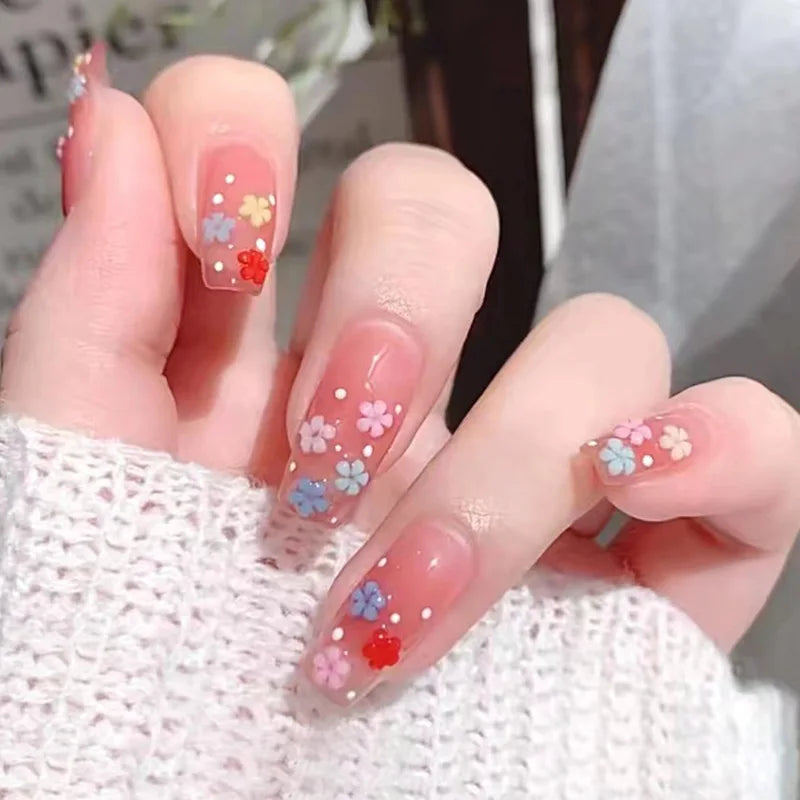 Decorated nail designs shown on hands