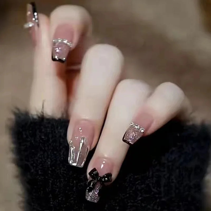 Decorated nail designs shown on hands