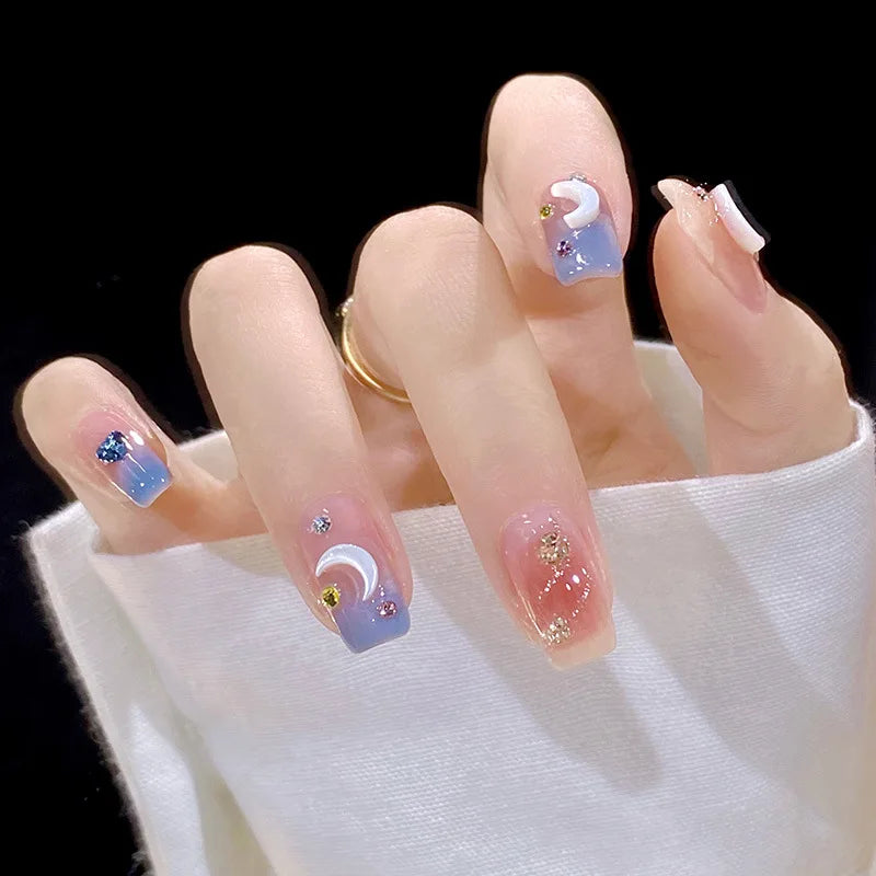 Decorated nail designs shown on hands