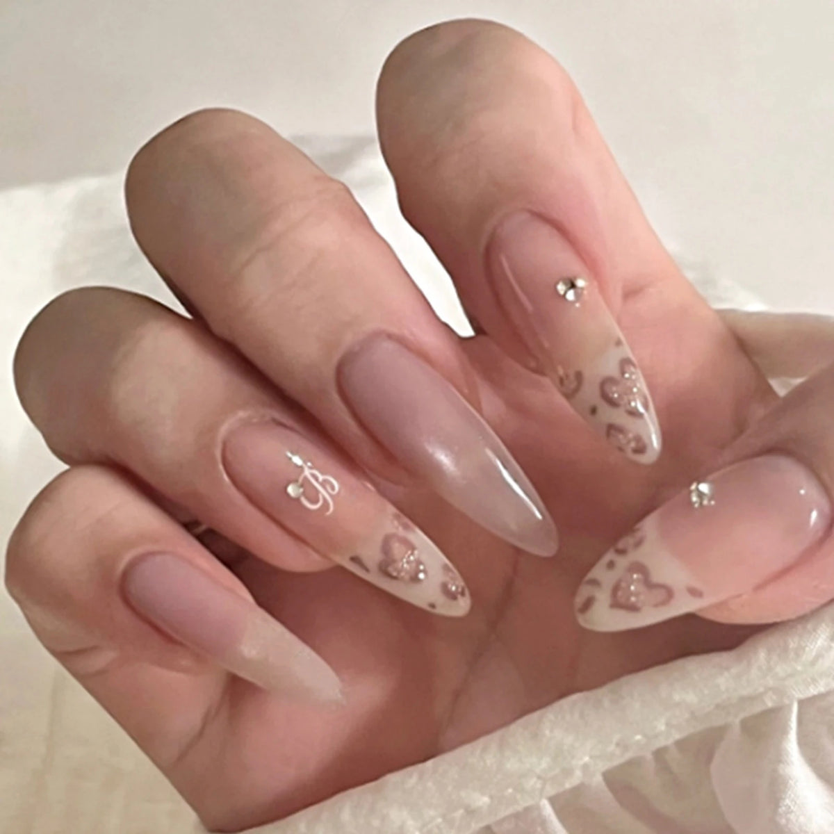 Decorated nail designs shown on hands