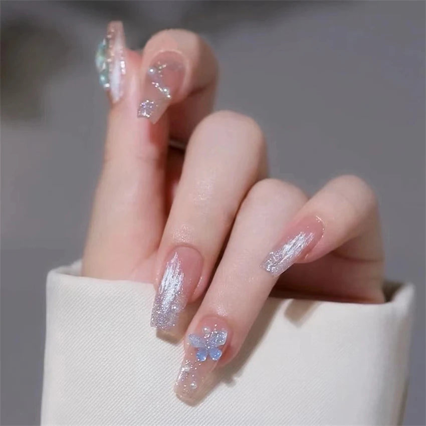 Decorated nail designs shown on hands