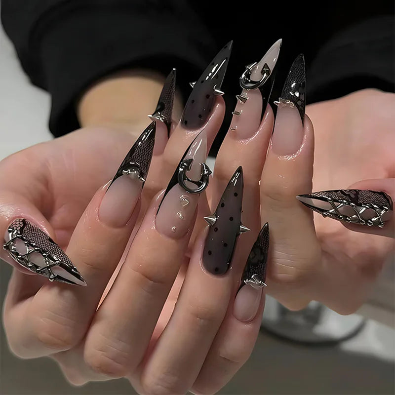 Long decorative pointed nails shown on hands