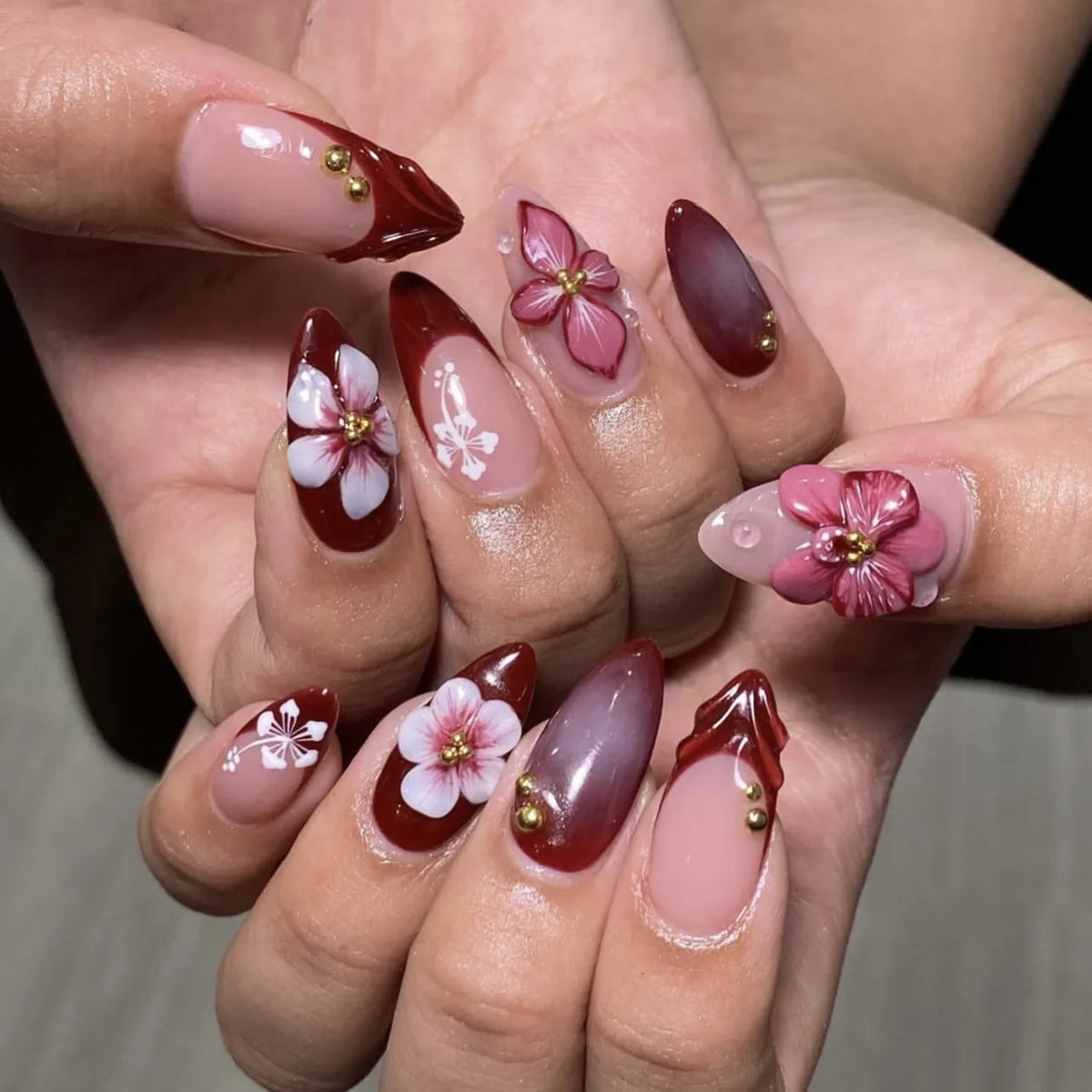 Decorated nail designs shown on hands