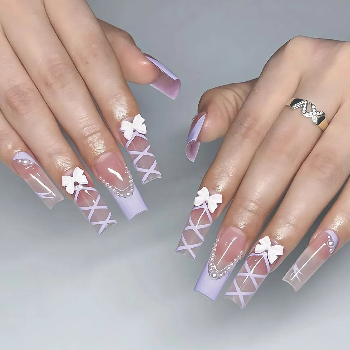 Decorated nail designs shown on hands