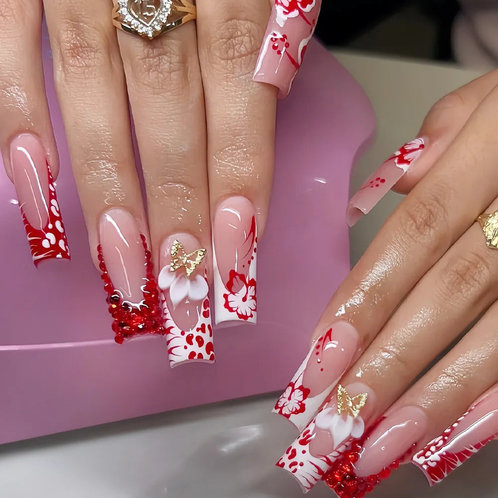 Long decorated nails with raised embellishments shown on hands