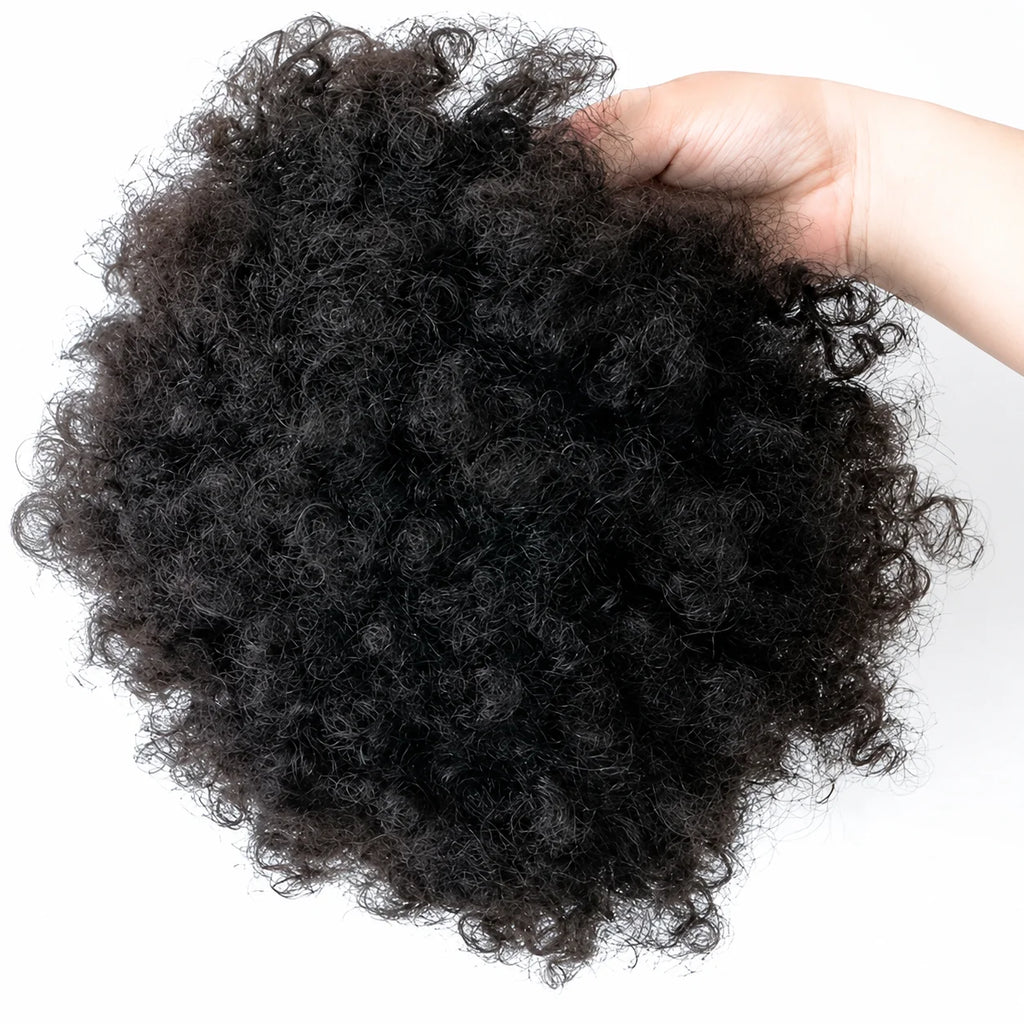 Close-up of curly hair topper held in a hand