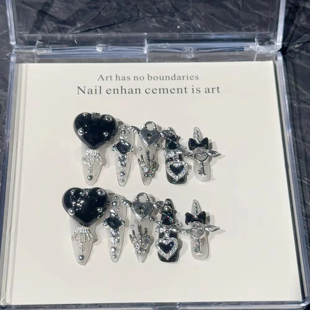 Decorated press-on nail sets with raised embellishments on display cards