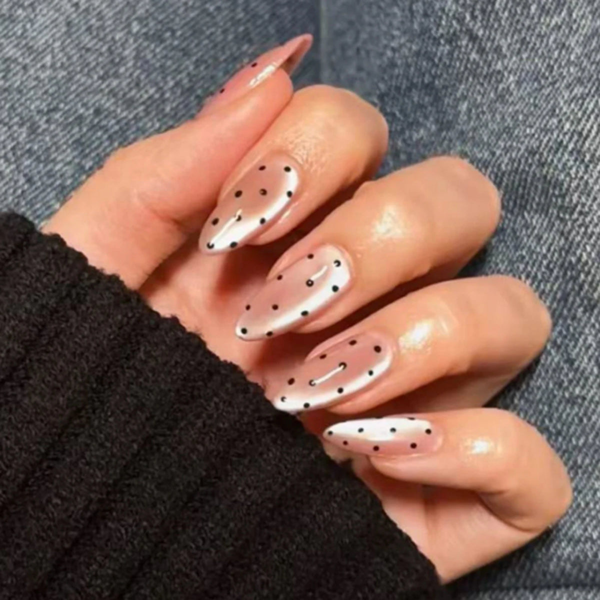 Decorated nail designs shown on hands