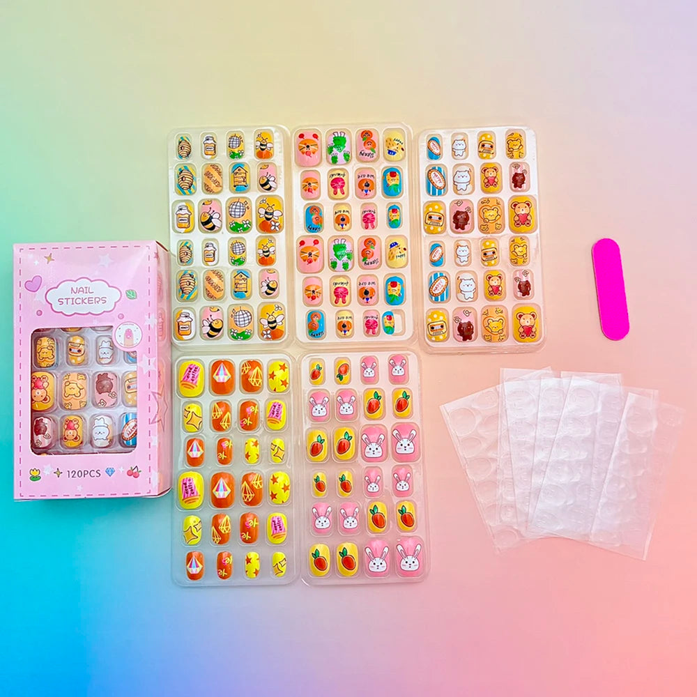 Assorted colorful press-on nails with packaging and manicure accessories