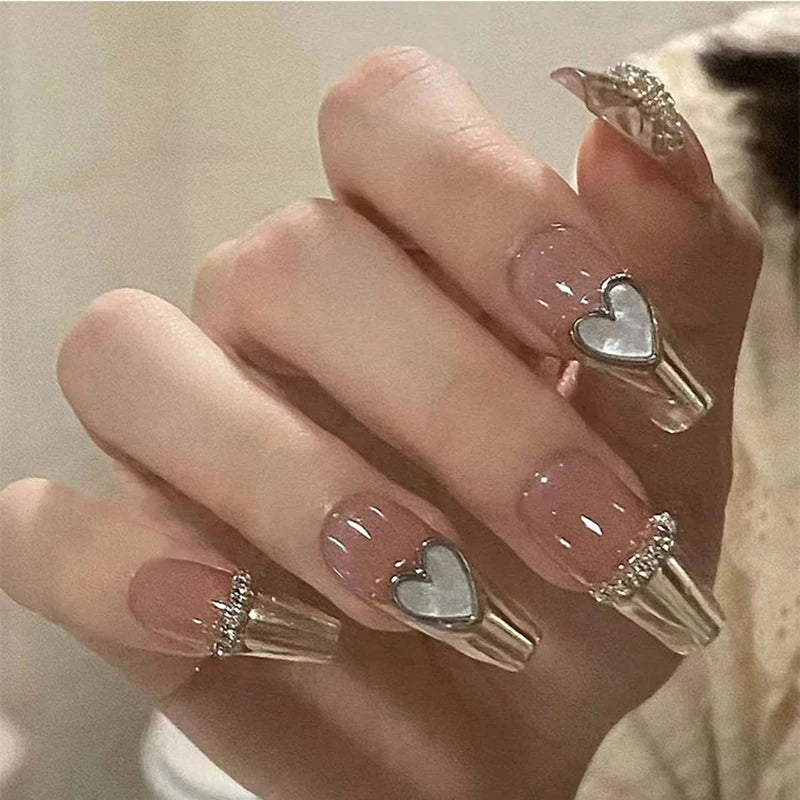 Decorated translucent nails shown on hands