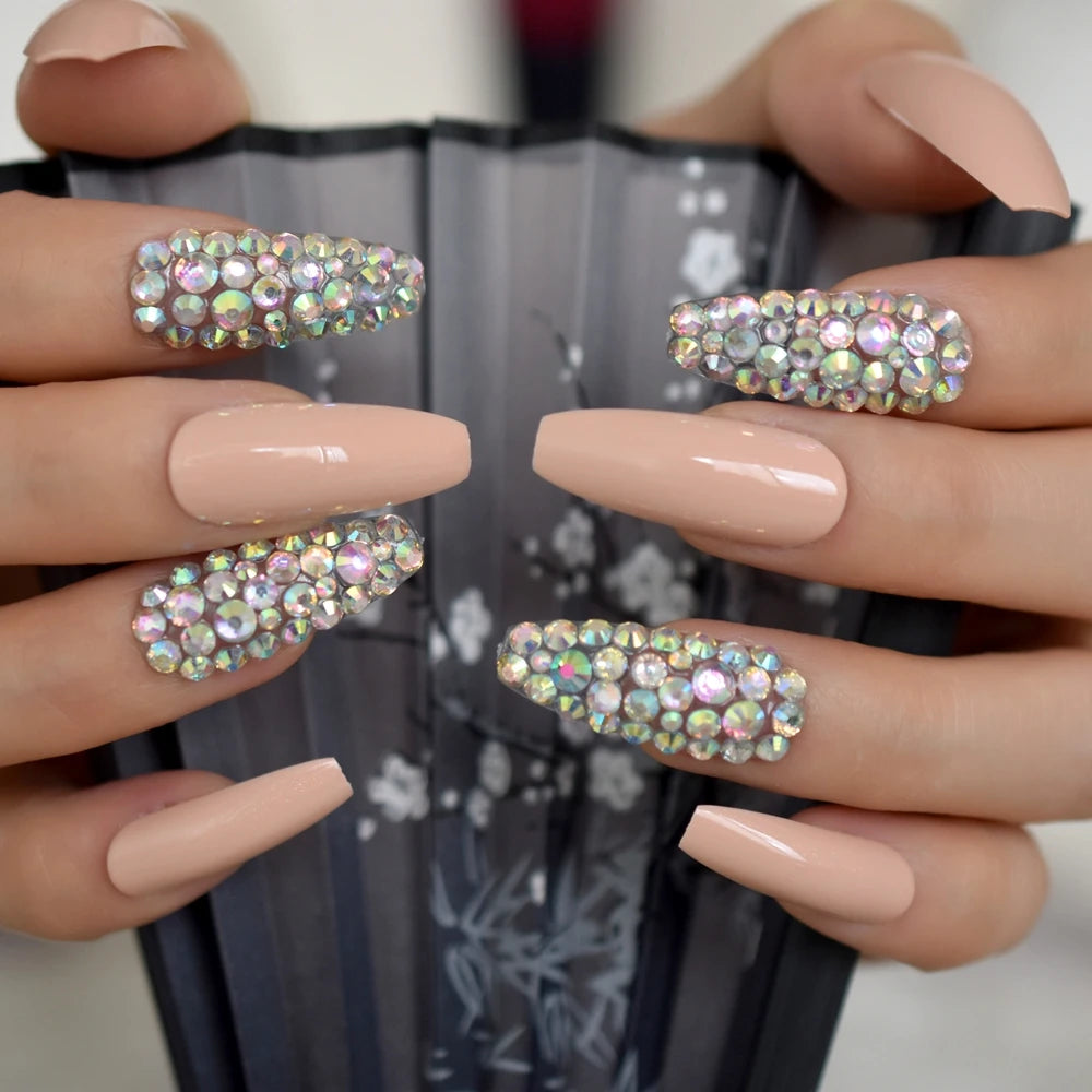 Rhinestone-decorated nail designs shown on hands