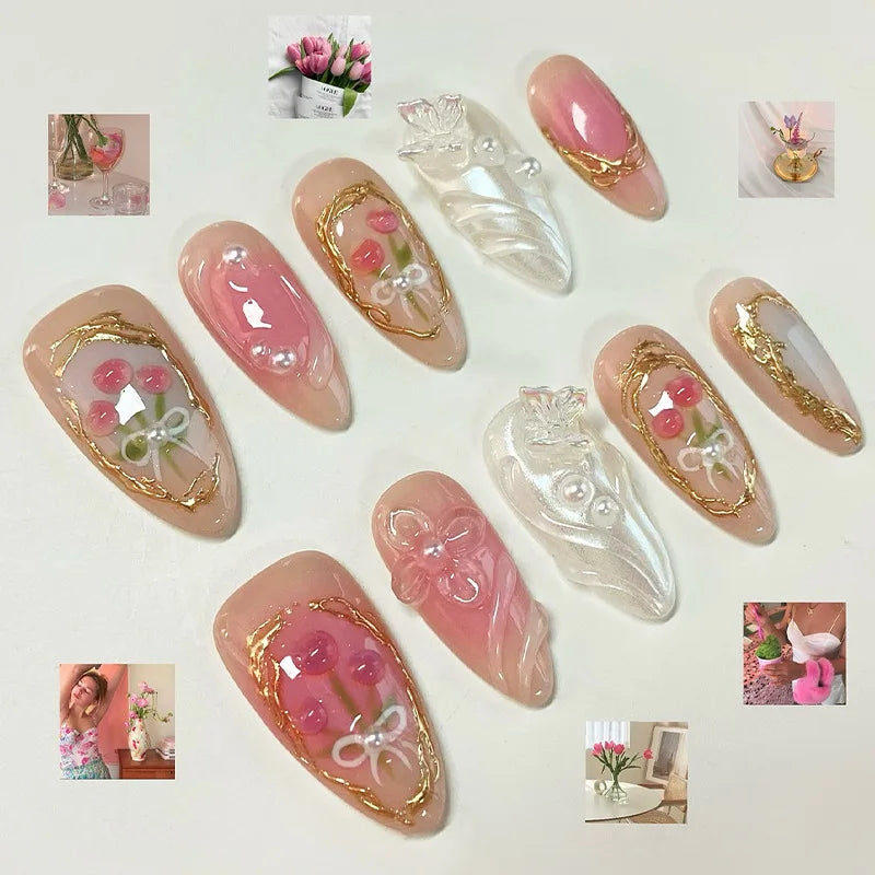 Pink and yellow decorated press-on nails arranged on a display