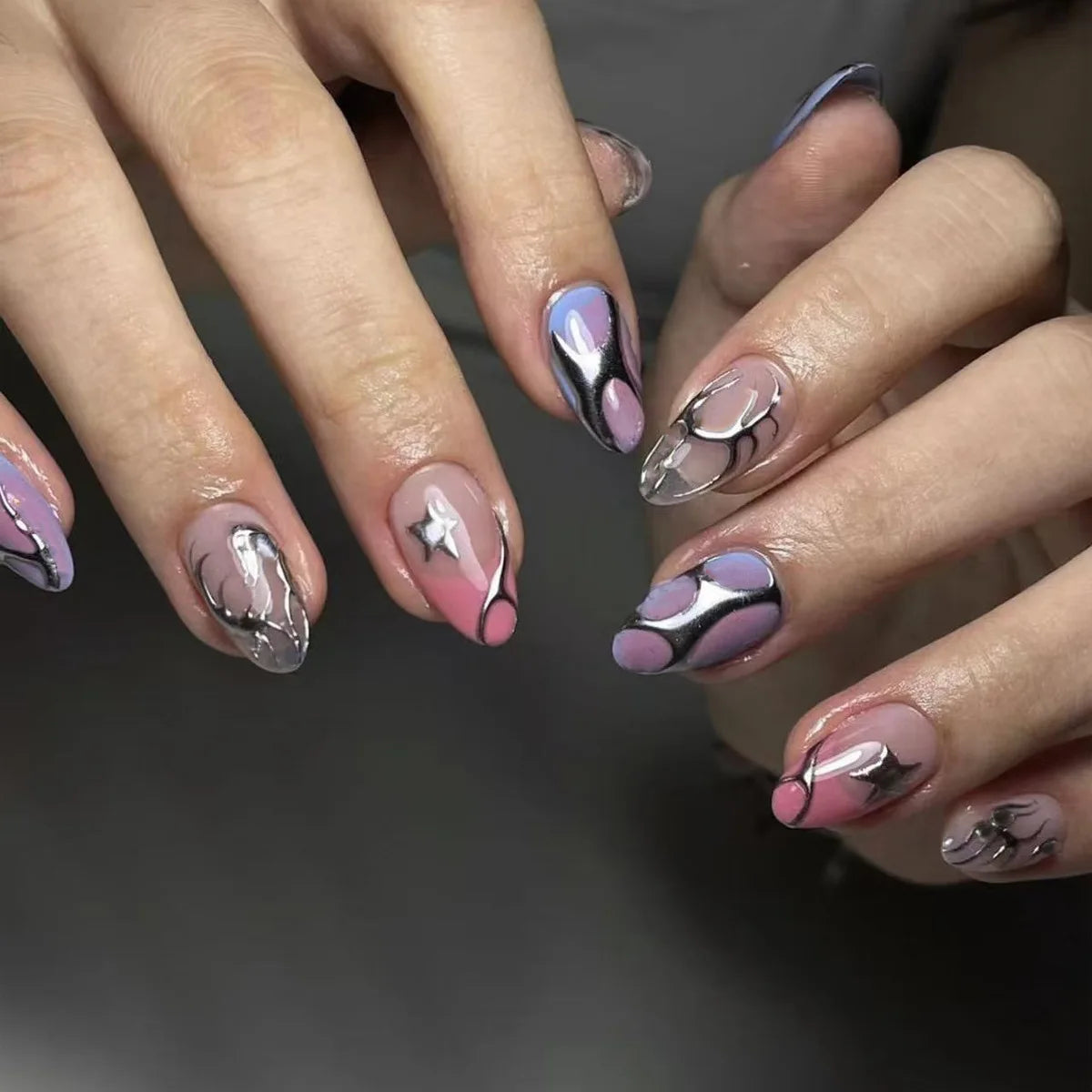 Decorated nail designs shown on hands