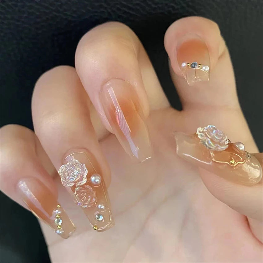 Decorated nail designs shown on hands