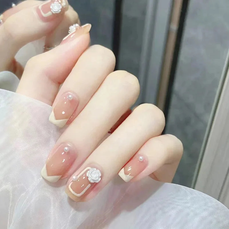Decorated nail designs shown on hands