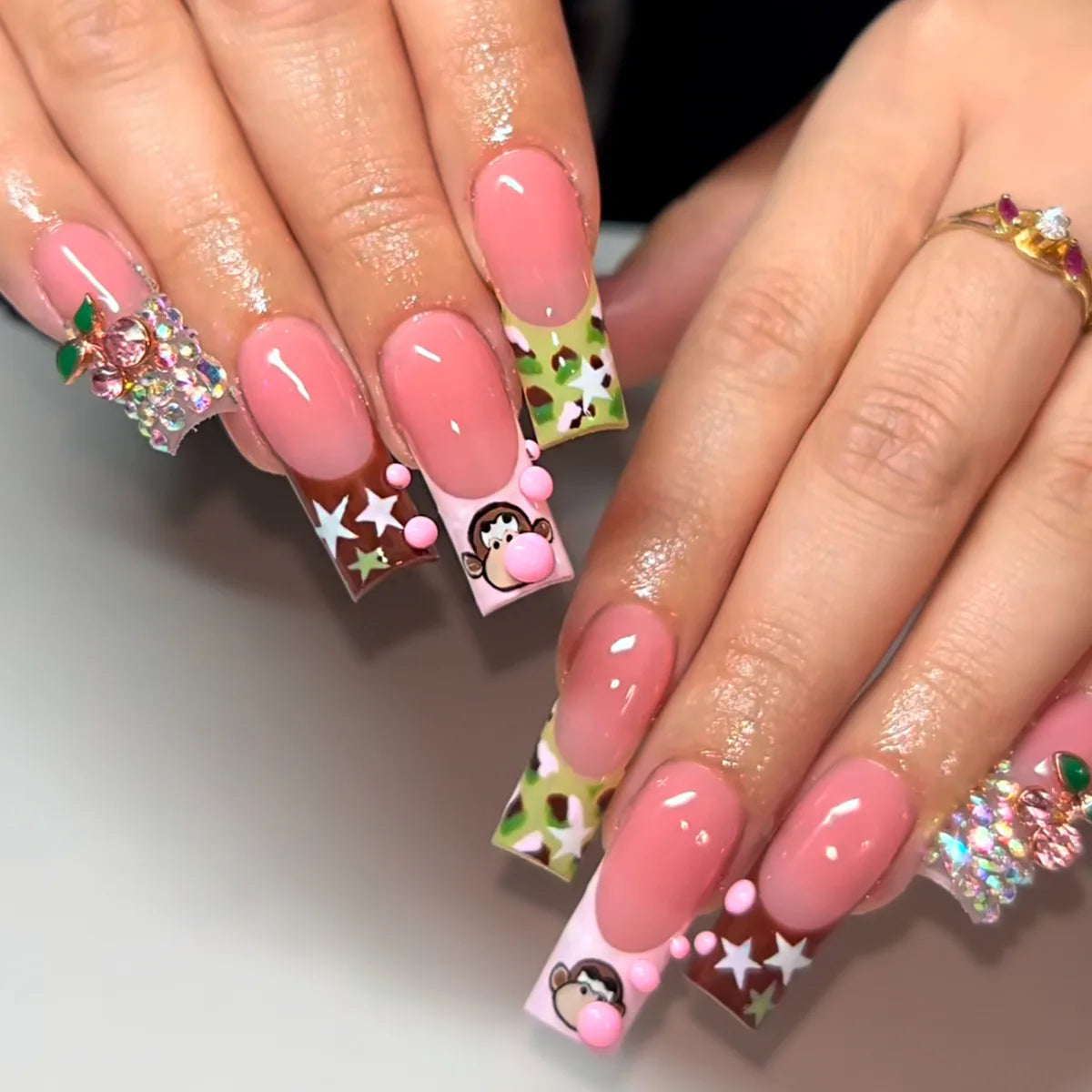 Decorated nail designs shown on hands