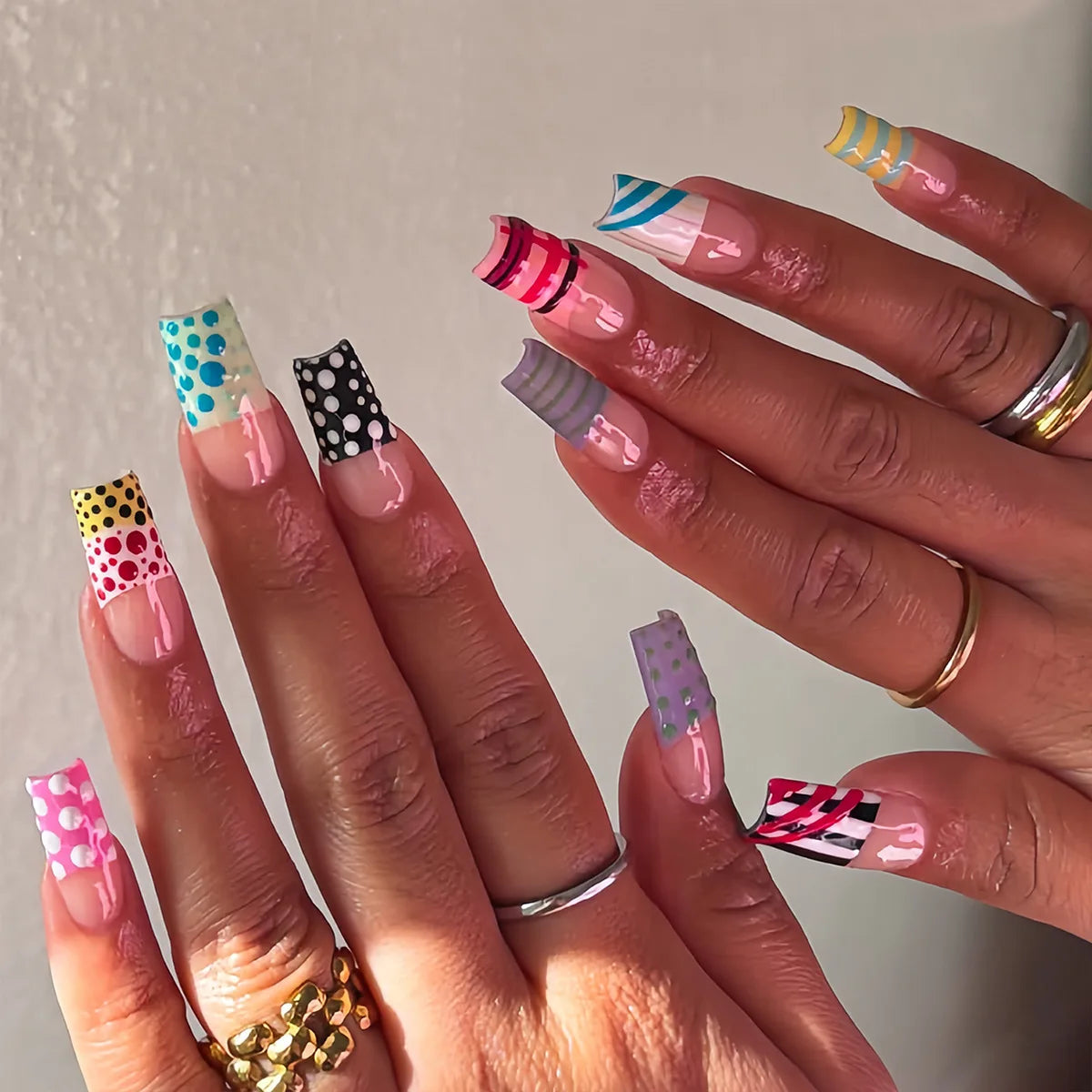 Decorated nail designs shown on hands