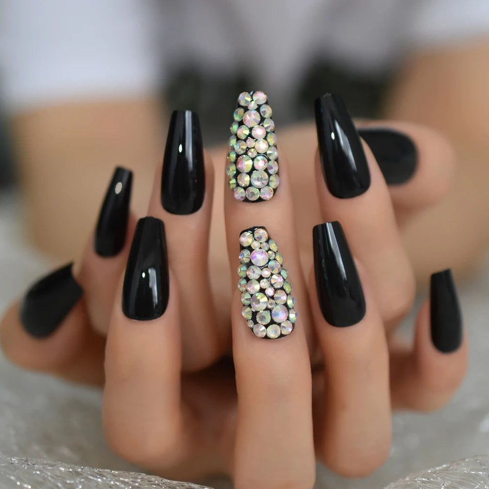 Rhinestone-decorated nail designs shown on hands