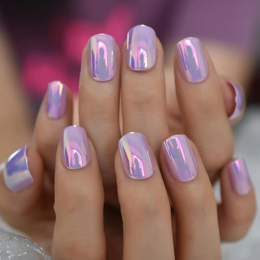 Purple chrome nails shown on hands