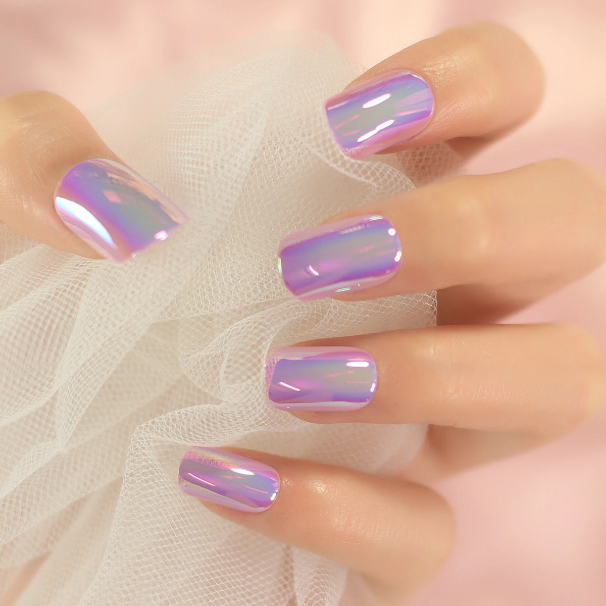 Chrome-finish nails shown on hands