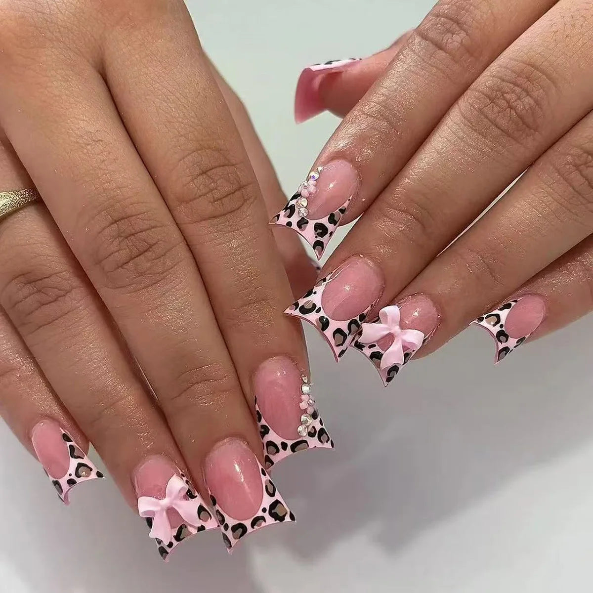 Decorative nail designs with raised accents shown on hands