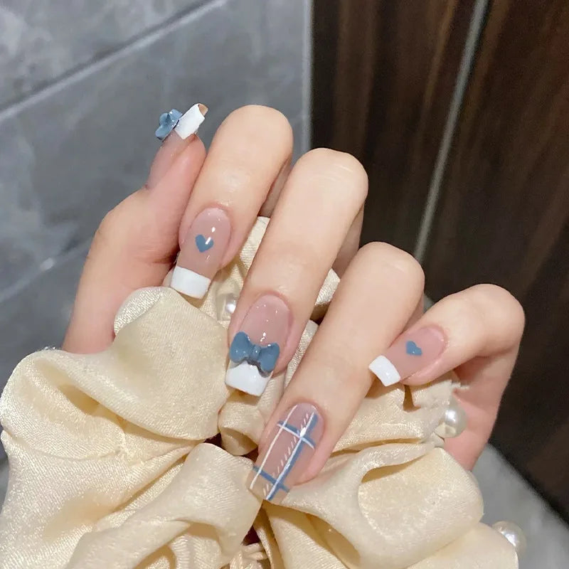 Decorated nail designs shown on hands
