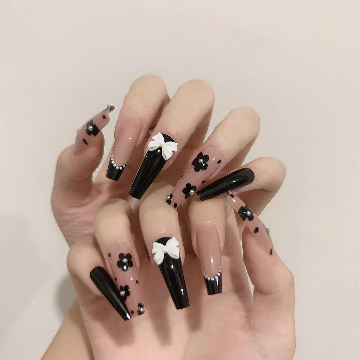 Decorated nail designs shown on hands