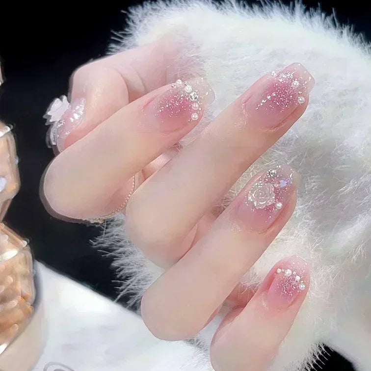 Decorated nail designs shown on hands