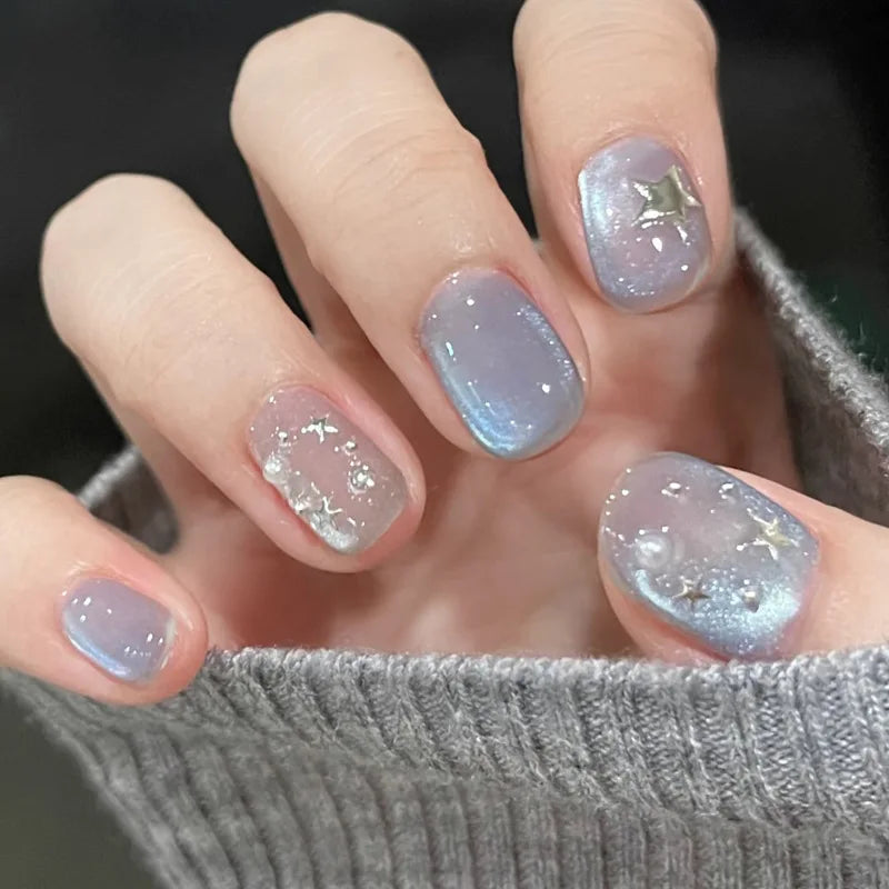 Decorated nail designs shown on hands