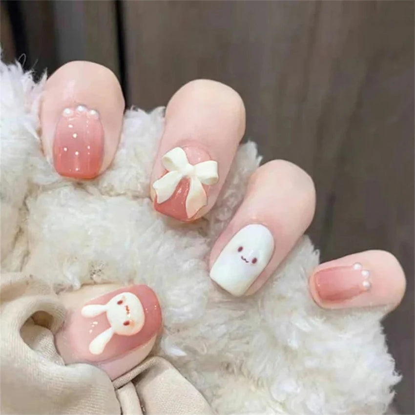 Decorated press-on nail designs shown on hands