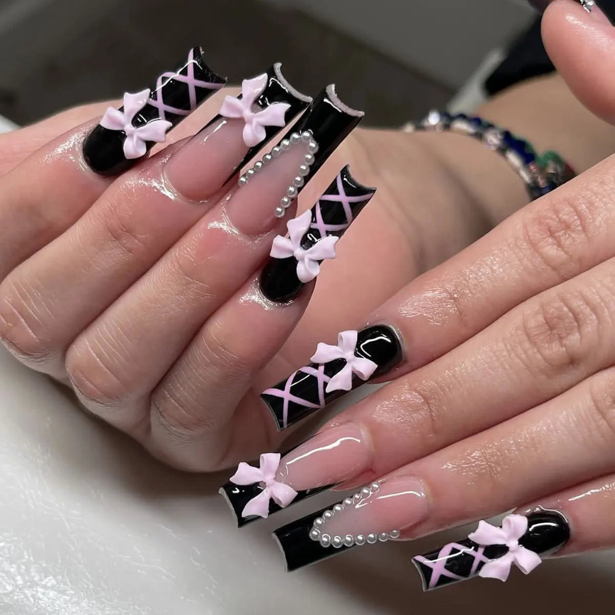 Decorated nail designs shown on hands