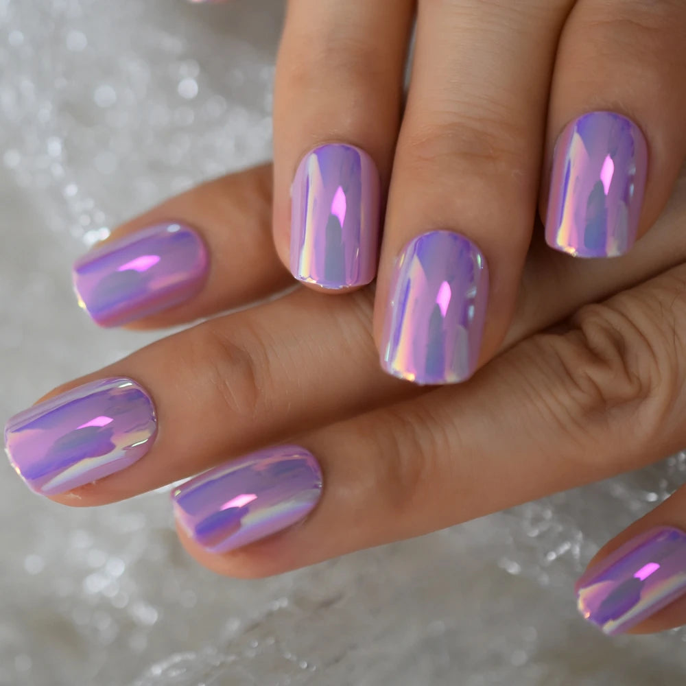 Purple chrome nails shown on hands