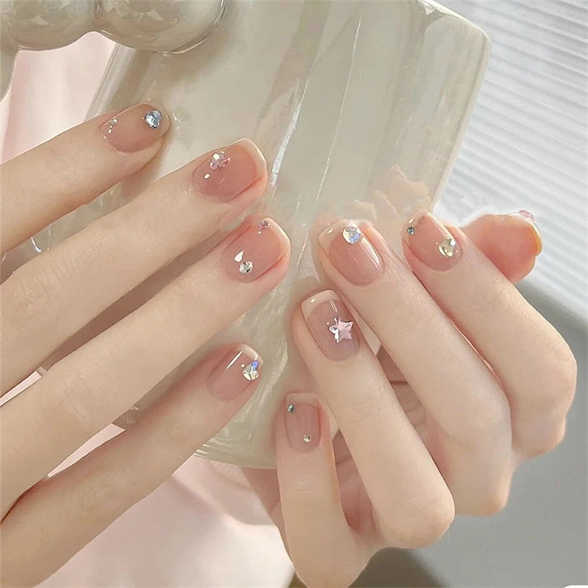 Decorated nail designs shown on hands